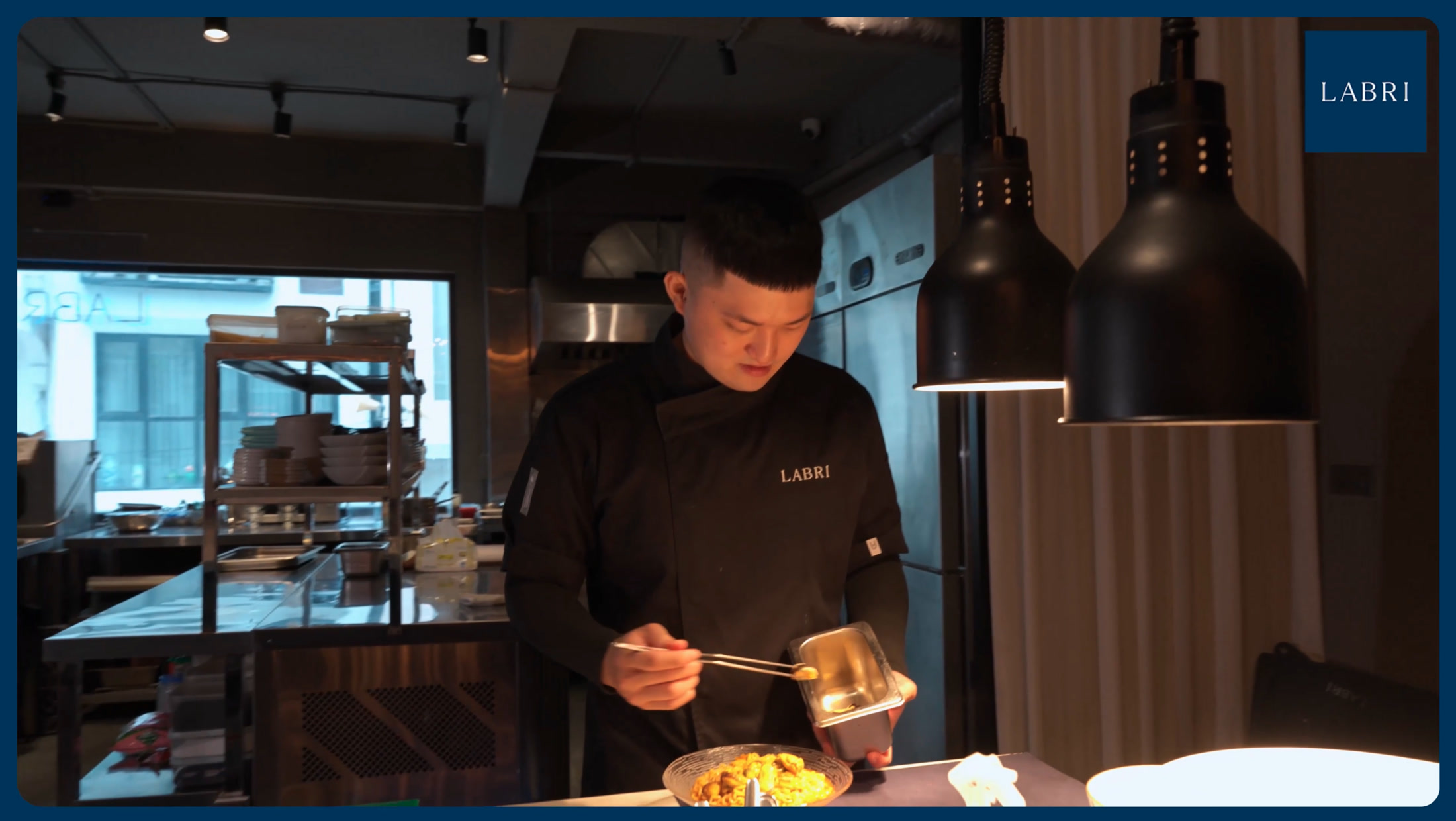 LABRI chef plating a seafood dish